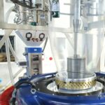 Blown film extrusion machine showing plastic bubble formation in packaging factory